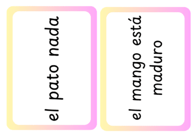 Dos tarjetas con frases en español. La primera tarjeta dice "el pato nada" con un borde rosa y amarillo. La segunda tarjeta dice "el mango está maduro" con los mismos colores del borde.