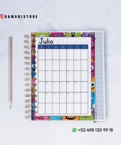 Un colorido calendario de julio con temática de monstruos está abierto sobre una superficie blanca, con un lápiz a la izquierda. La información de contacto de Instagram y WhatsApp de 